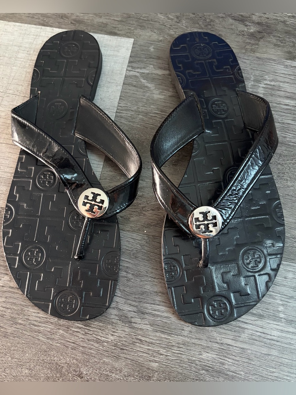 Tory Burch Black Patent Logo Thong Sandals with Silver Medallions